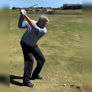 Gary Battersby at the top of the backswing on the fairway