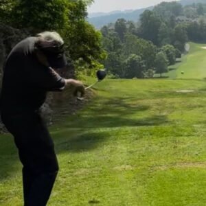 Gary Battersby driving from an elevated tee